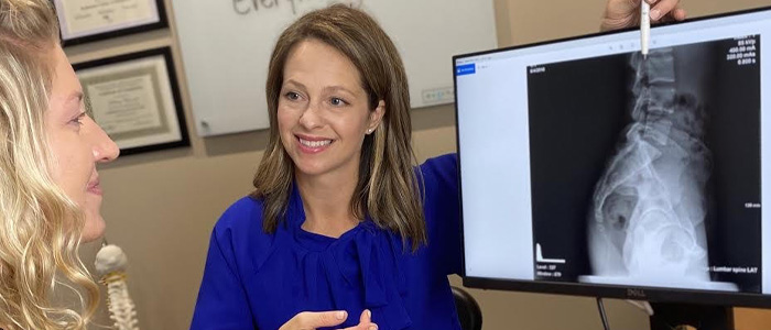 Chiropractor Chanhassen MN Bethany Curnow Looking At X-Ray Chiropractor Chanhassen MN Bethany Curnow Looking At X-Ray
