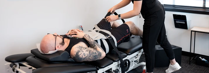 Chiropractic Chanhassen MN Bulged or Herniated Disc Patient being adjusted on table.